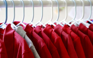 red uniform shirts on a hanger