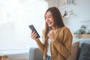 remote employee checking rewards program on phone